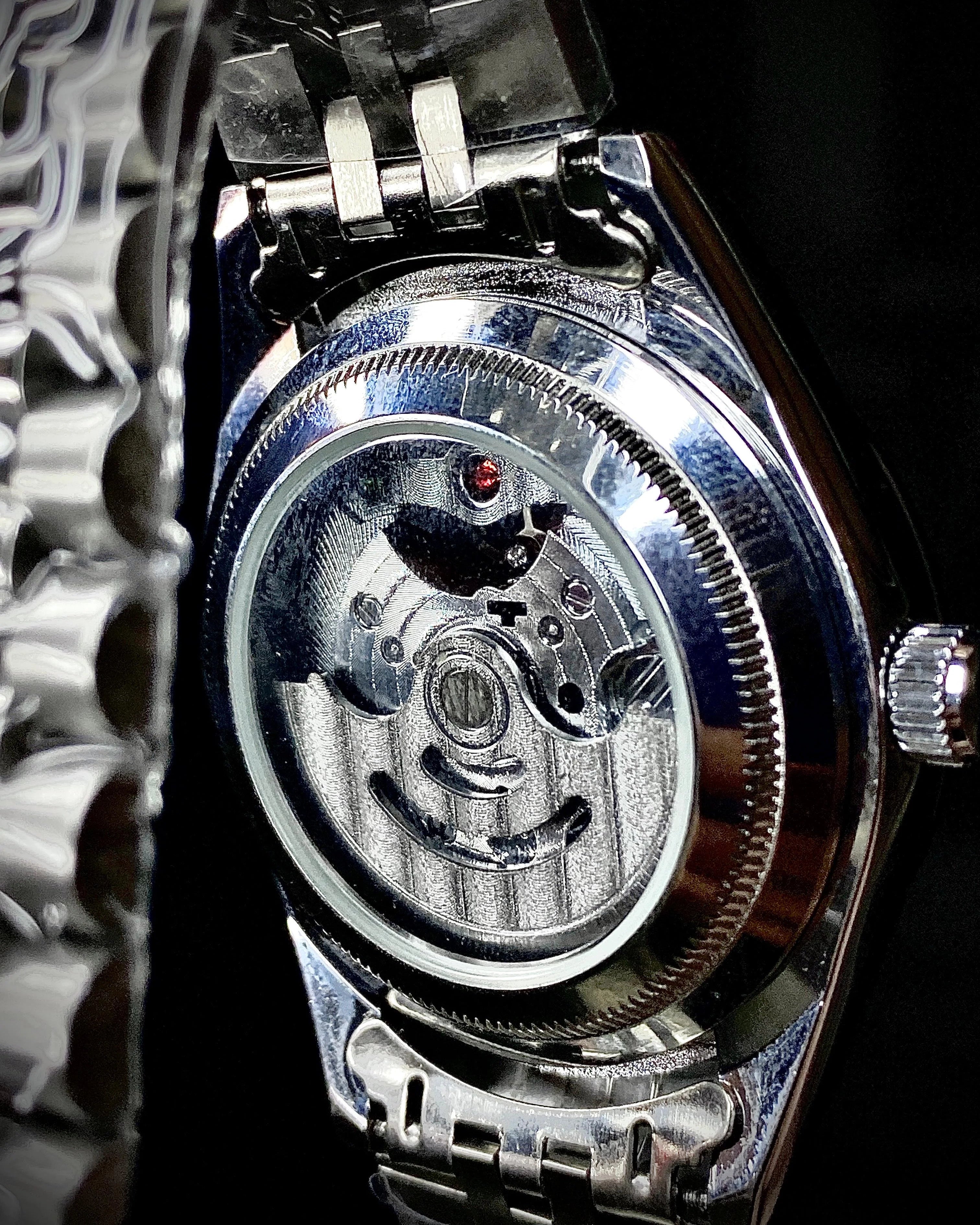 Close-up of a mechanical watch with visible gears and movement