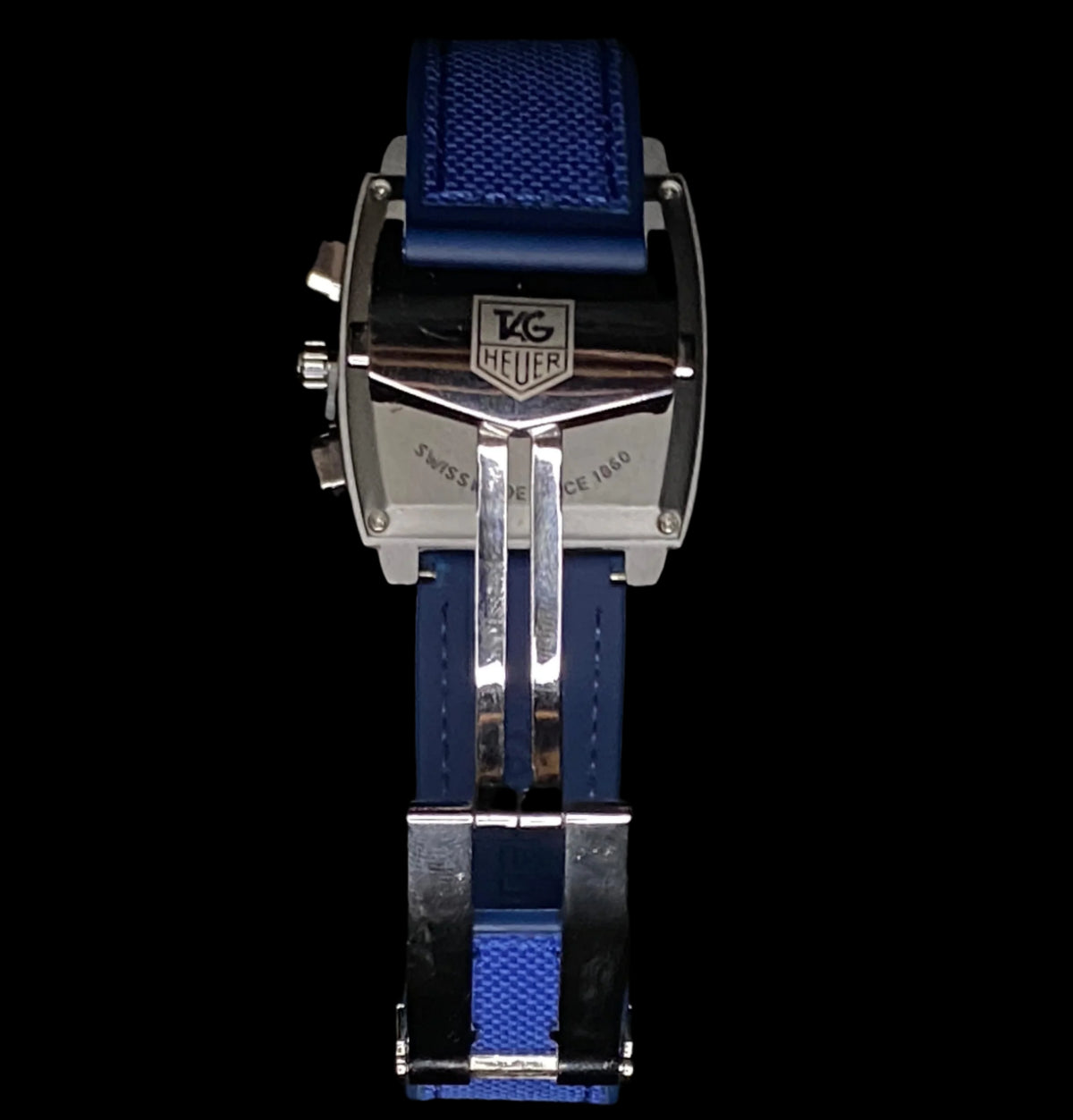 Tag Heuer watch with blue strap on a black background